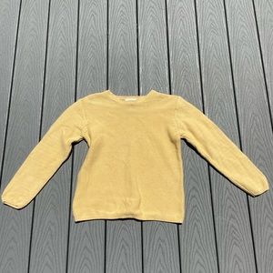 Yellow sweater.